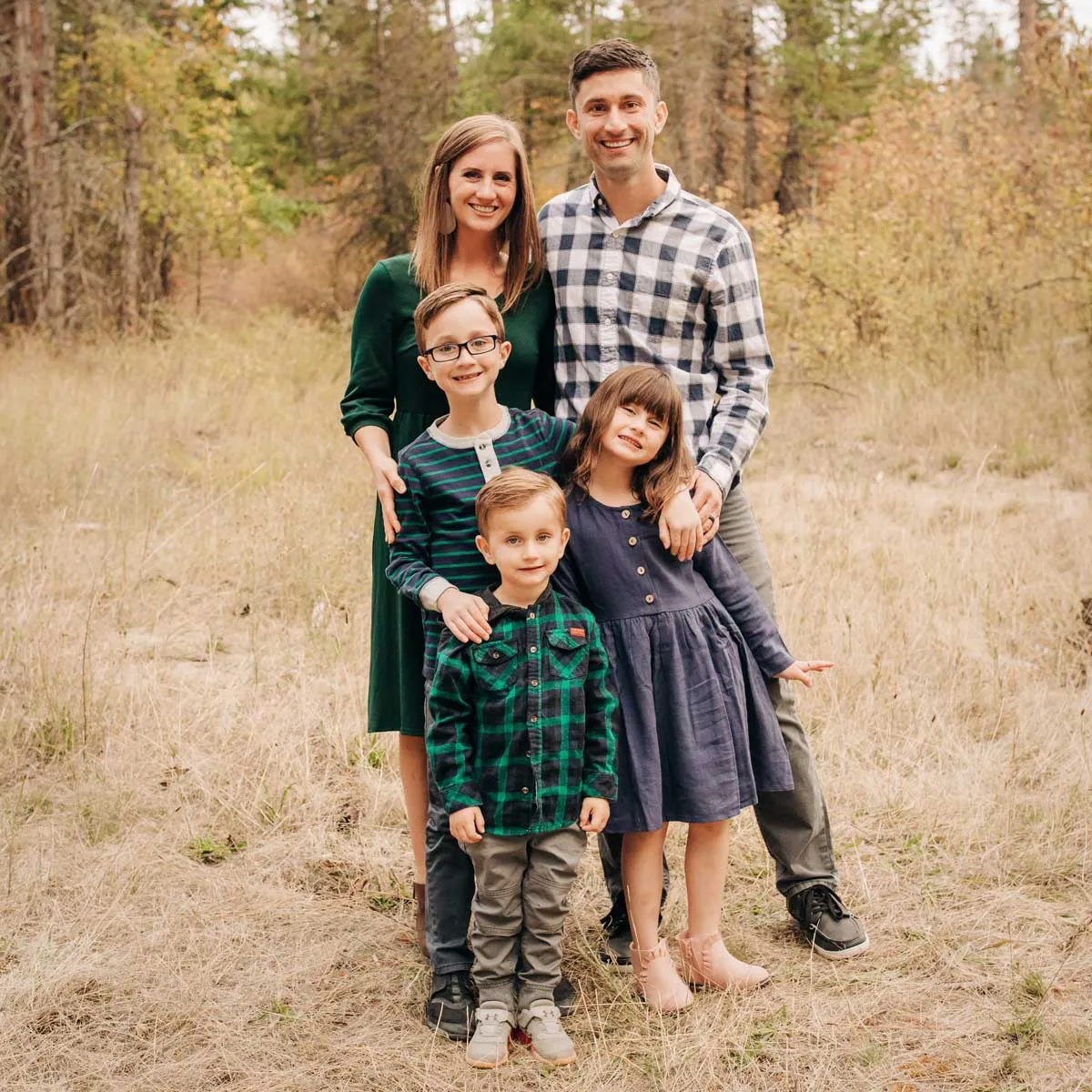 The Irwin family posing together for a family photograph.